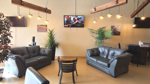 Wave of the Future 3D event and meeting space with leather seating, display screens and wood beam lighting